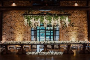 Suspended flowers above the sweetheart table. 